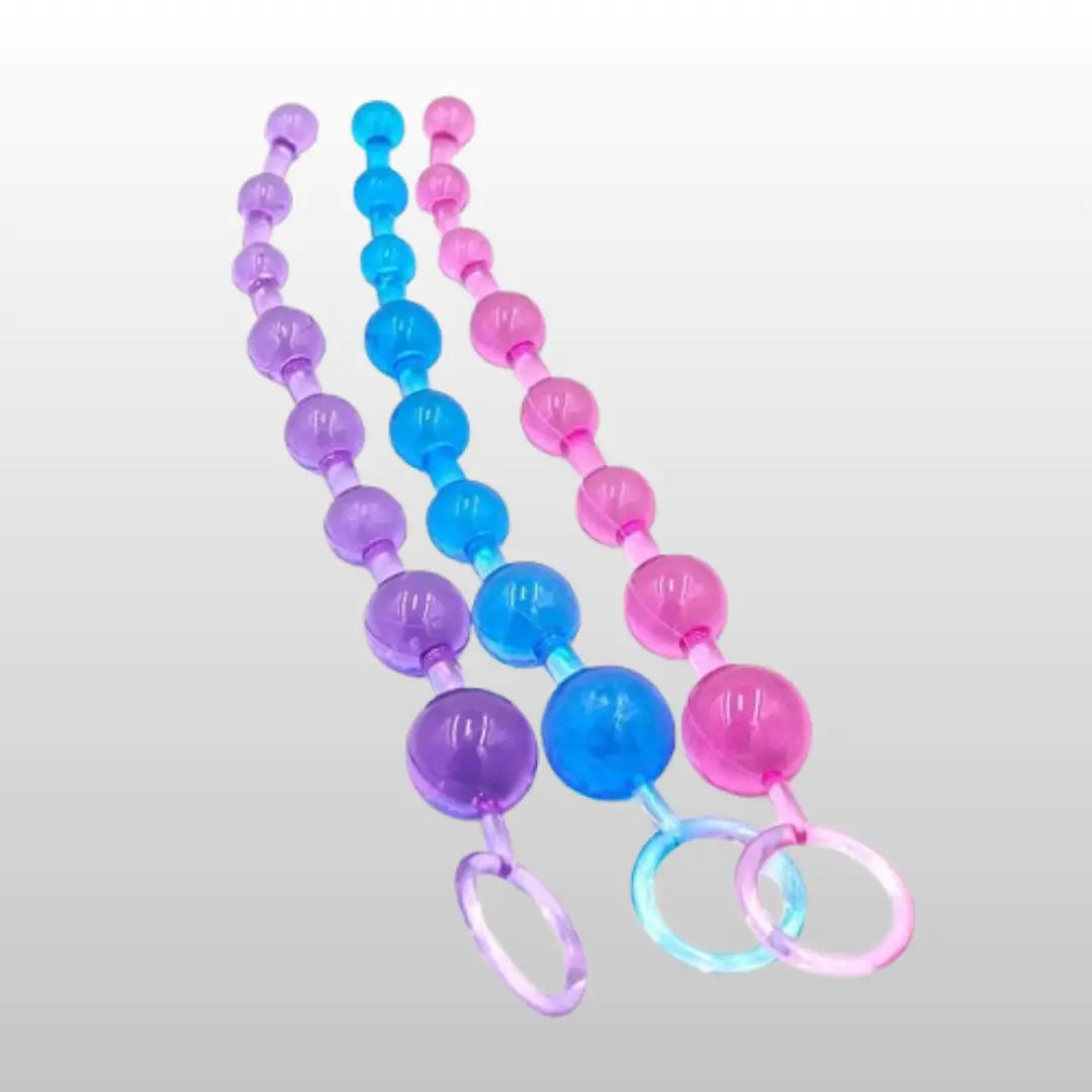 Set of three anal beads in pink, blue, and purple colors with ring handles