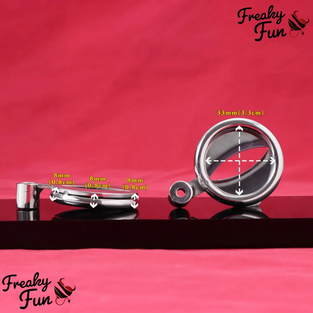 Metallic sissy cage with ring with measurements on a red background, branded 'Freaky Fun'.