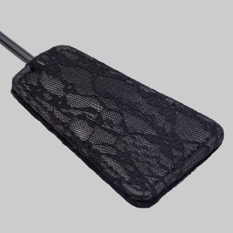 Black textured luggage tag on a white background
